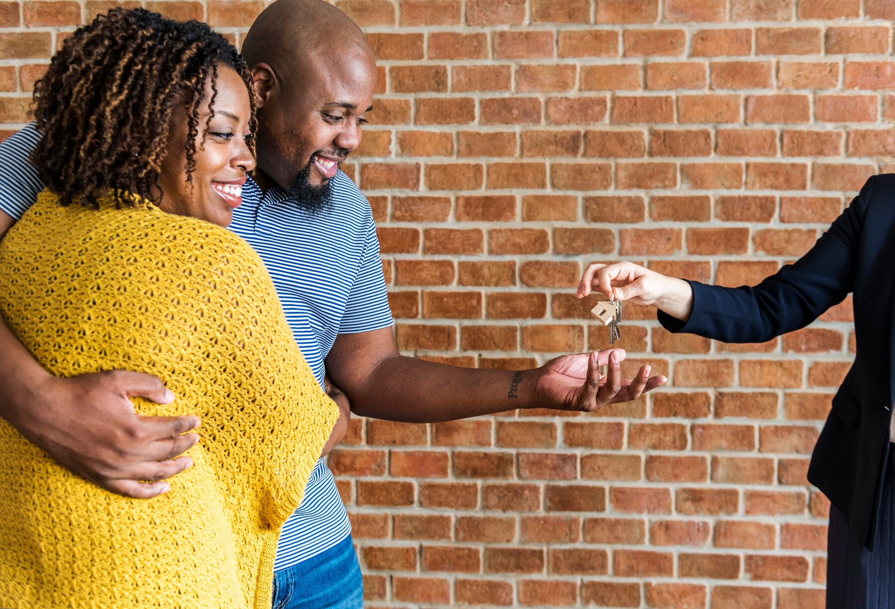 Happy couple receiving house keys
